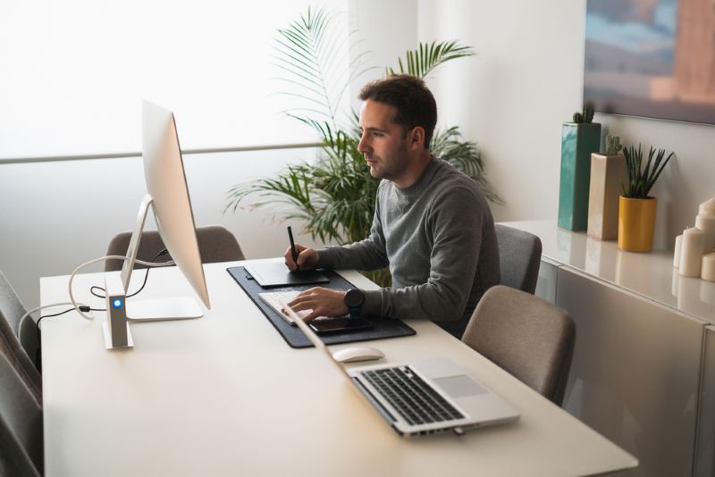 Man doing research from his desk at home